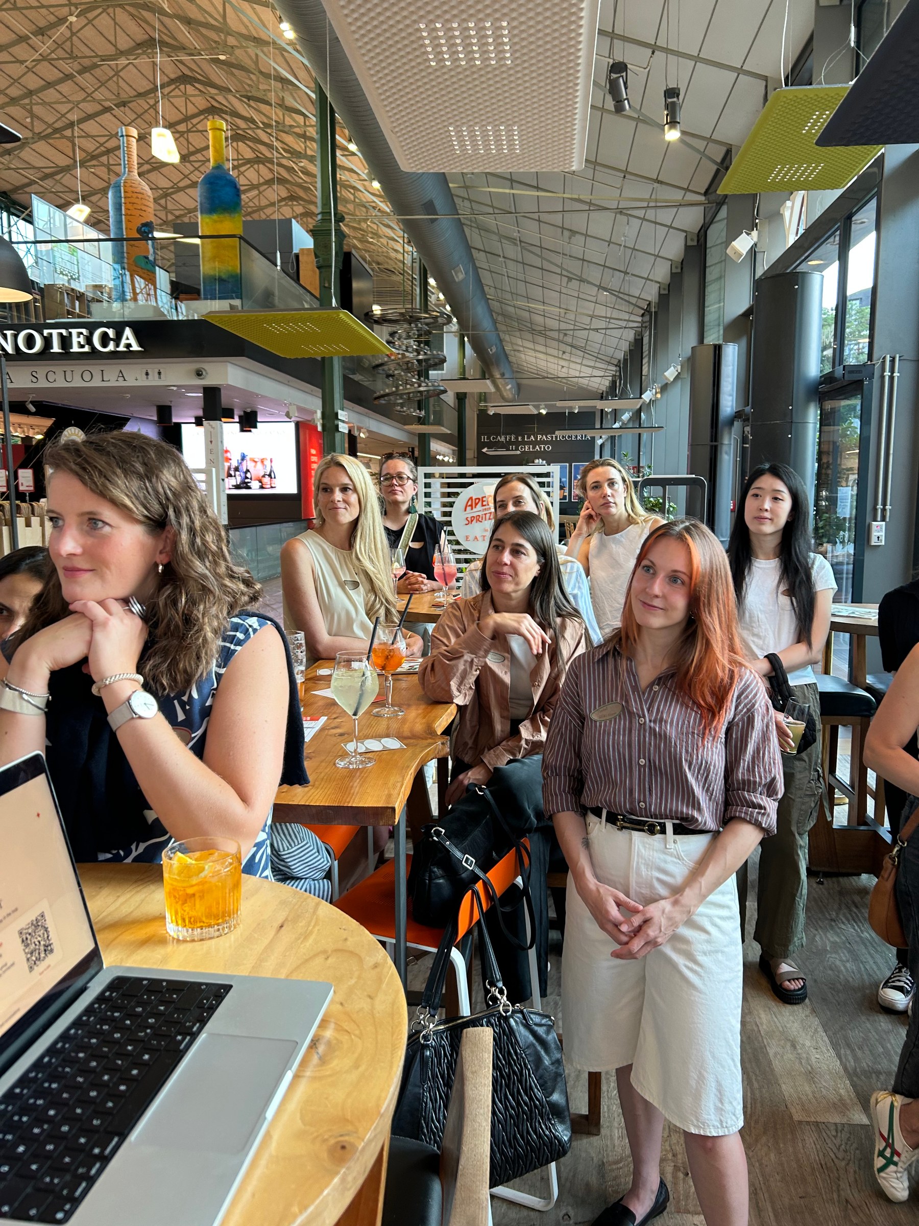 Women gathered around a table at the first Women in AI Social in Munich.