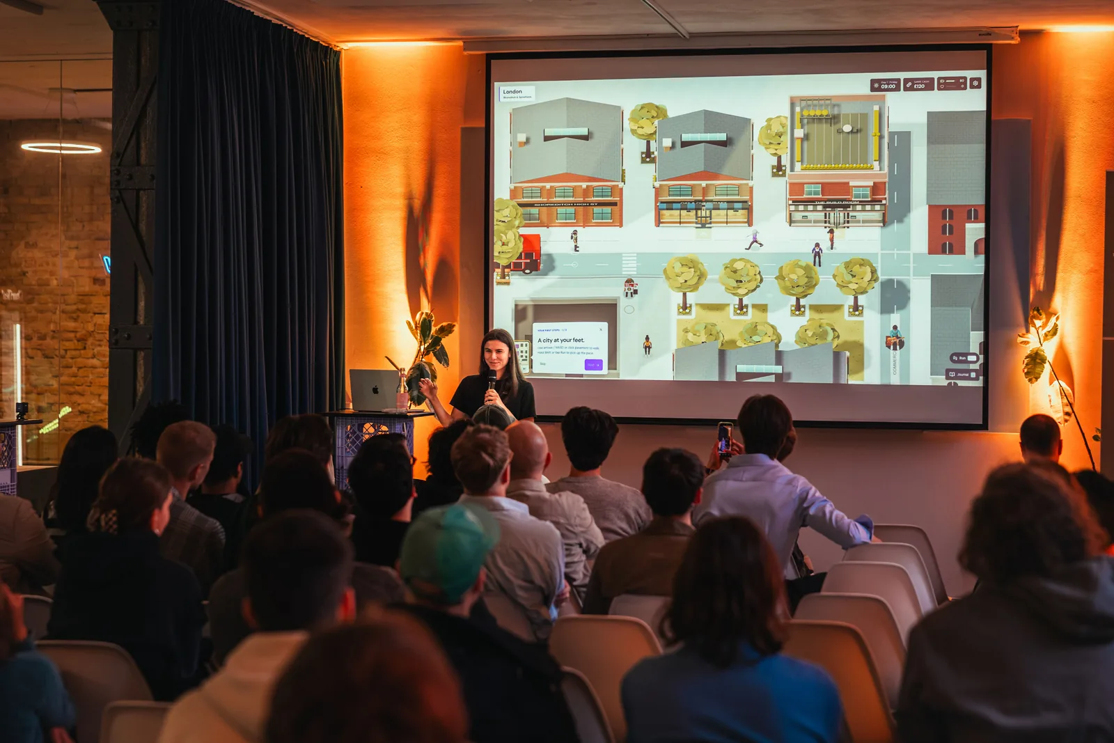 Lara demonstrating Europe, the Game to an audience in Berlin.