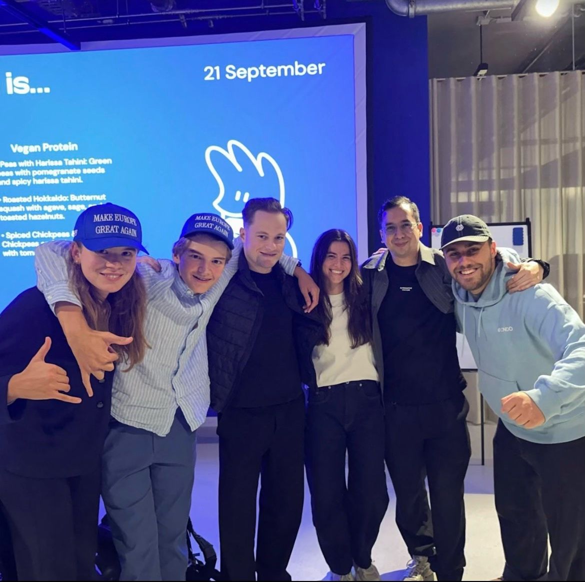 Lara and other attendees posing together at an event in Berlin.