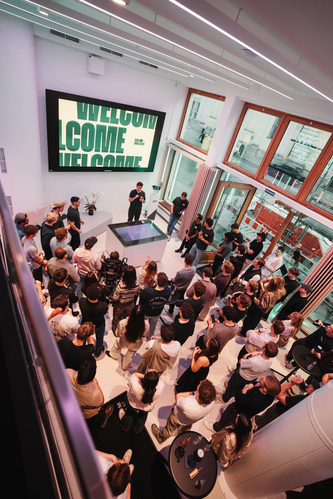An overhead view of attendees gathered for the Isar Unfiltered welcome event.