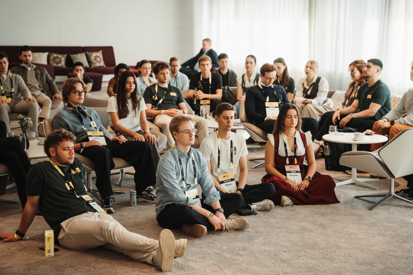Isar Unfiltered participants taking part in a seated breathwork session.